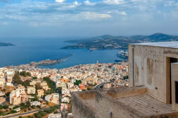 View of houses in the bay of Syros and the other islands on the horizon